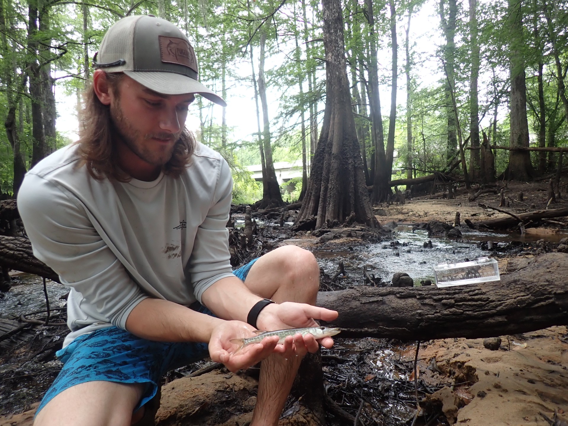 Fish biologist with fish friend