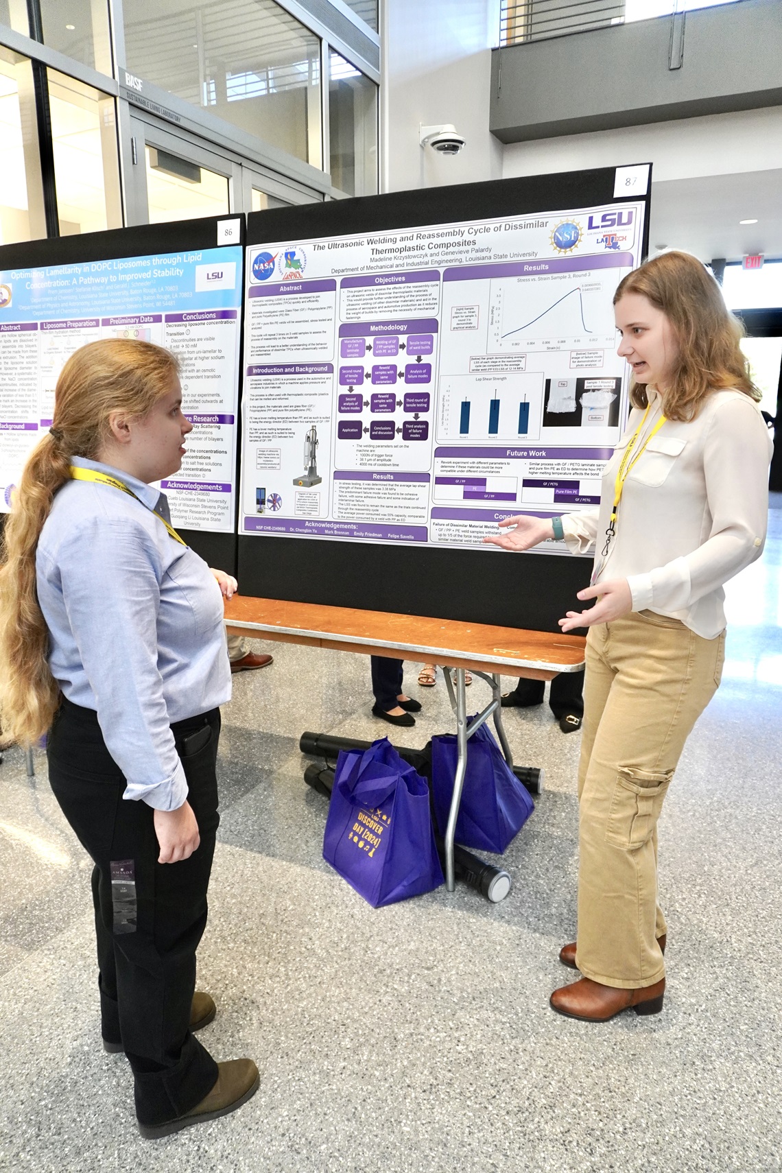 Student presenting their research poster