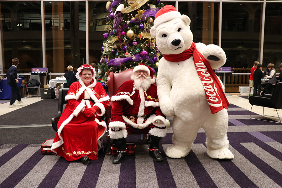 costumed staff with Santa and Mrs. Claus